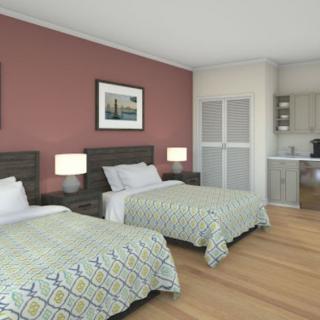 A cozy hotel room with twin beds and soft lighting.
