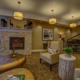 A cozy living room with a fireplace and modern interior design.