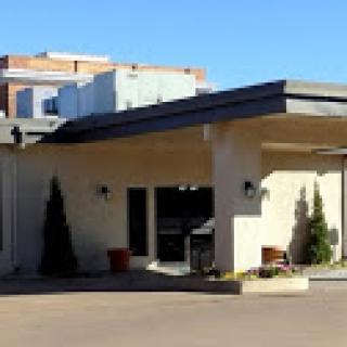 A modern entrance to a commercial building, showcasing clean lines and contemporary design.