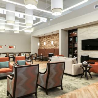 A modern lobby with stylish seating and ambient lighting.