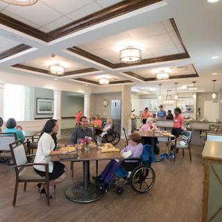 A welcoming dining area in a senior living community, where residents engage in social activities.