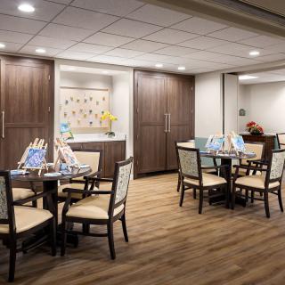 A modern dining area with wooden floors and contemporary furniture.