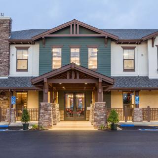 A well-lit hotel exterior with a welcoming entrance.