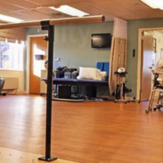 A rehabilitation clinic featuring physical therapy equipment and comfortable seating.