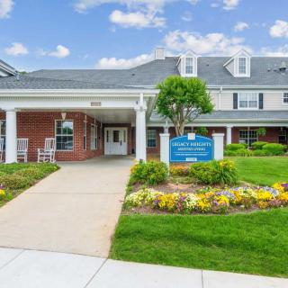 Entrance to a healthcare facility with well-maintained landscaping and signage.