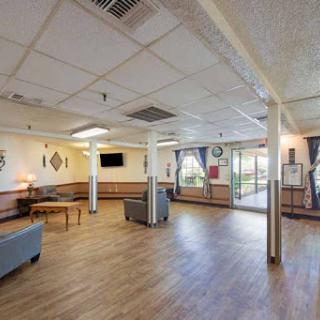 A spacious and inviting lounge area featuring comfortable seating and natural light.