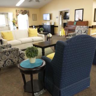 A cozy and inviting living room space with comfortable seating and warm colors.