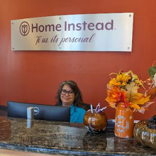 A welcoming reception area at Home Instead, featuring autumn decorations.