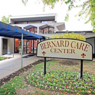 The entrance to Bernard Care Center, featuring a prominent sign and modern architecture.