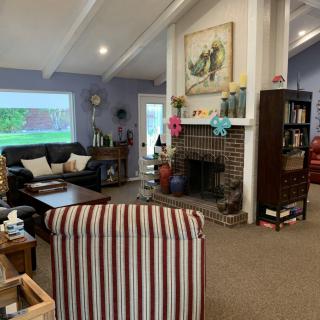 A cozy living room with a fireplace and comfortable seating.