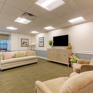 A cozy and modern living room with comfortable seating and a television.