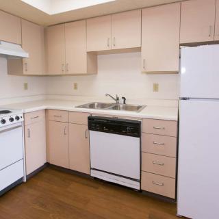 A clean and simple kitchen with essential appliances.