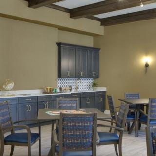 A cozy dining area with wooden furniture and a stylish cabinet setup.