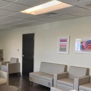 A modern waiting room with comfortable seating and minimalist decor.