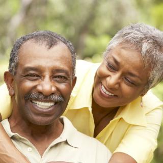 A happy senior couple enjoying time together outdoors.