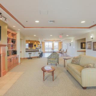A spacious and inviting community living room designed for relaxation and social interaction.