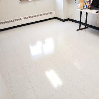 A bright and clean room with a polished floor.