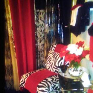 A chic corner featuring zebra print furniture and elegant decor elements.