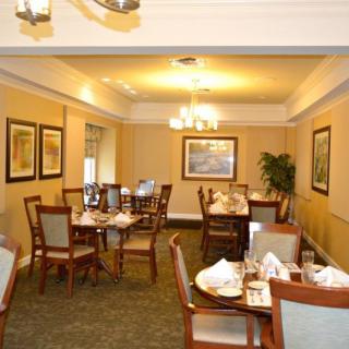 A cozy dining room with neatly arranged tables and elegant decor.