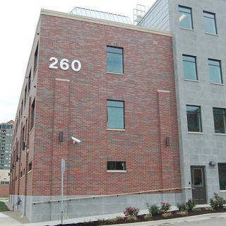 A brick building with the address number 260 visible on its facade.