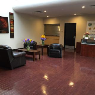 A modern lobby featuring comfortable seating and decorative elements.