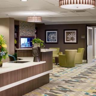 A modern hotel lobby with comfortable seating and stylish decor.