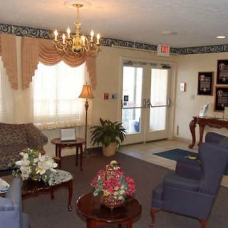 A cozy living room with elegant furniture and decor.