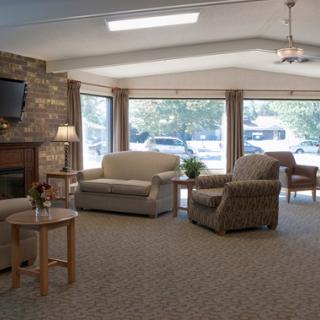 A cozy living room setup with comfortable furniture and ample natural light.