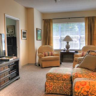 A cozy living room with comfortable furniture and soft lighting.