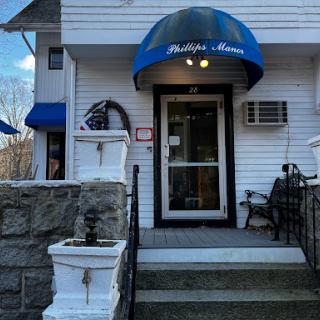 The inviting entrance of Phillips House, complete with decorative elements and a welcoming atmosphere.