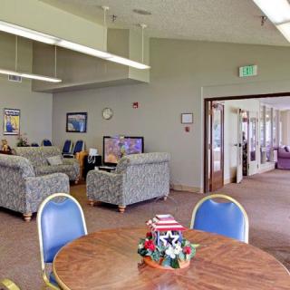 A cozy waiting area with comfortable seating and a decorated table in a communal space.