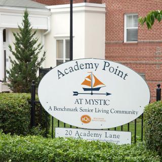 Sign for Academy Point at Mystic, a senior living community.