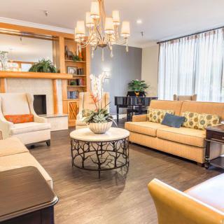A cozy and elegantly designed living room with stylish furniture and a warm ambiance.