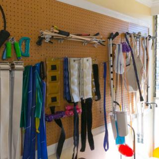 A well-organized pegboard in a garage displaying various tools and equipment.