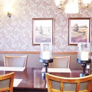 A beautifully arranged dining room showcasing elegant decor and inviting ambiance.
