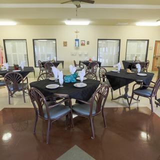 A well-arranged dining area with neatly set tables, ready for patrons.