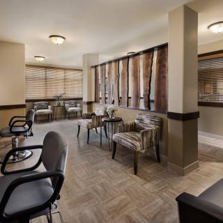 A modern waiting room with comfortable seating and stylish decor.