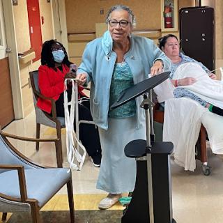 An uplifting moment in a rehabilitation center, where individuals engage in recovery activities.