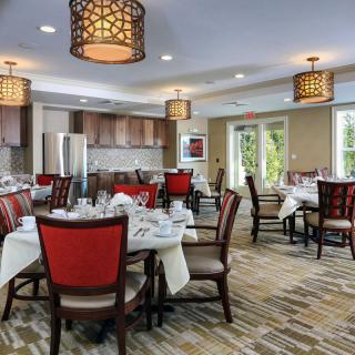 A well-decorated dining area with elegant furniture and ambient lighting.