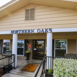 Entrance to the Northern Oaks building with exterior signage.