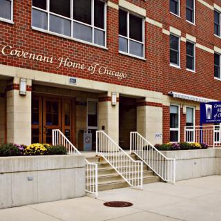 The entrance to a brick building with stairs leading up, labeled as 'Covenant House Chicago'.