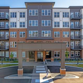 A modern apartment complex with a welcoming entrance.