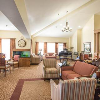 Spacious and well-furnished living area with comfortable seating and elegant dcor.