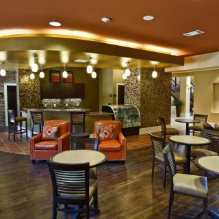 A modern cafe interior with comfortable seating and stylish decor.