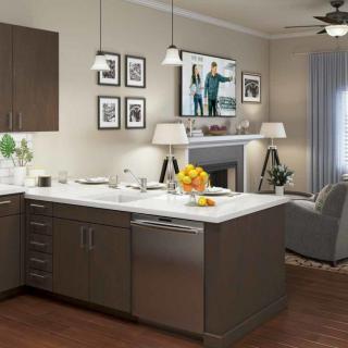 A modern open-concept kitchen and living room with a central island and stylish decor.