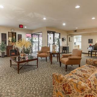 A spacious lobby area featuring comfortable seating and elegant decor.