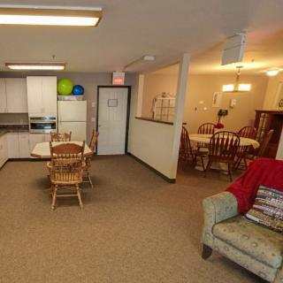 A cozy open-plan space with a kitchen, dining area, and living room.