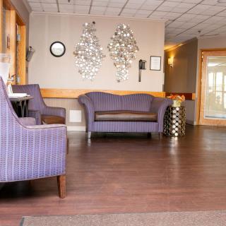 A modern waiting room with comfortable seating and stylish decor.