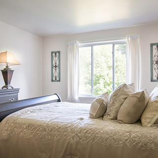 Bright and airy bedroom with elegant decor.