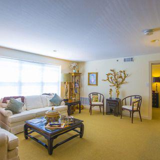 A cozy living room with comfortable seating and elegant decor.